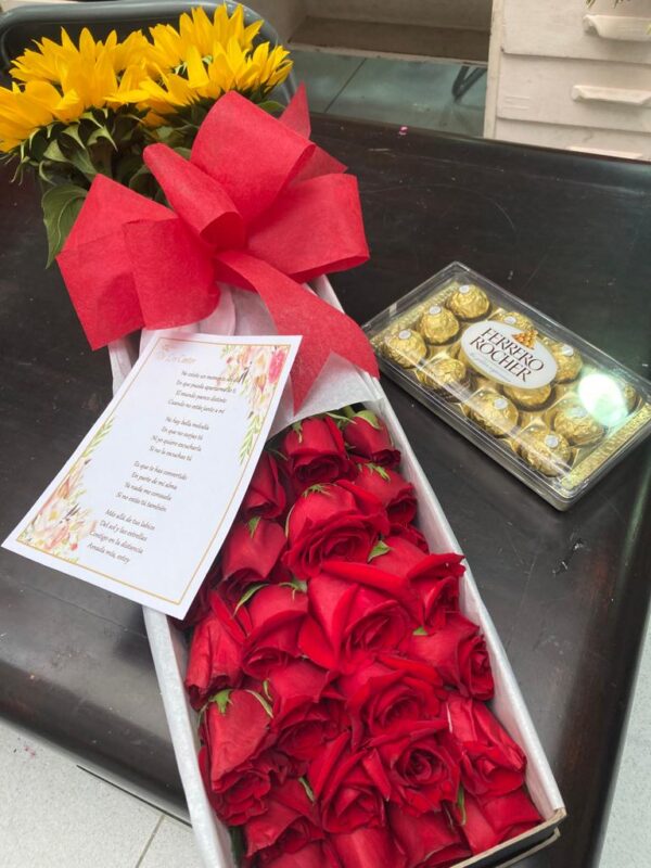 Caja larga de rosas y girasoles con adicional de chocolates